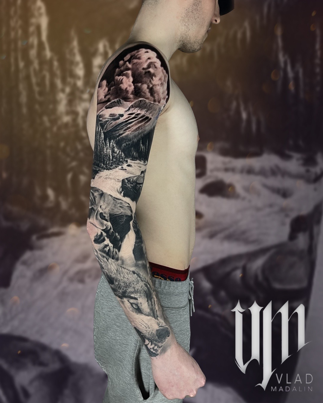 Wolf, mountain and woodland sleeve tattoo by Vlad Madalin